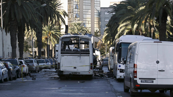 A damaged bus is seen at the scene of a suicide bomb attack in Tunis