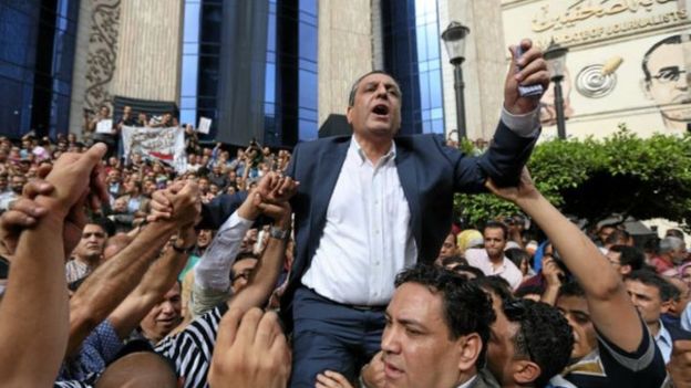 _92560166_160530134923_journalists_carry_yehia_kalash_head_of_the_egyptian_press_syndicate_640x360_reuters_nocredit
